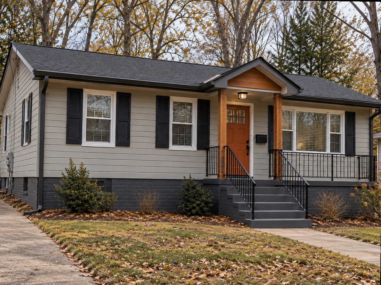 The same ranch after renovation — new siding, black shutters, cedar-post entry porch and rails